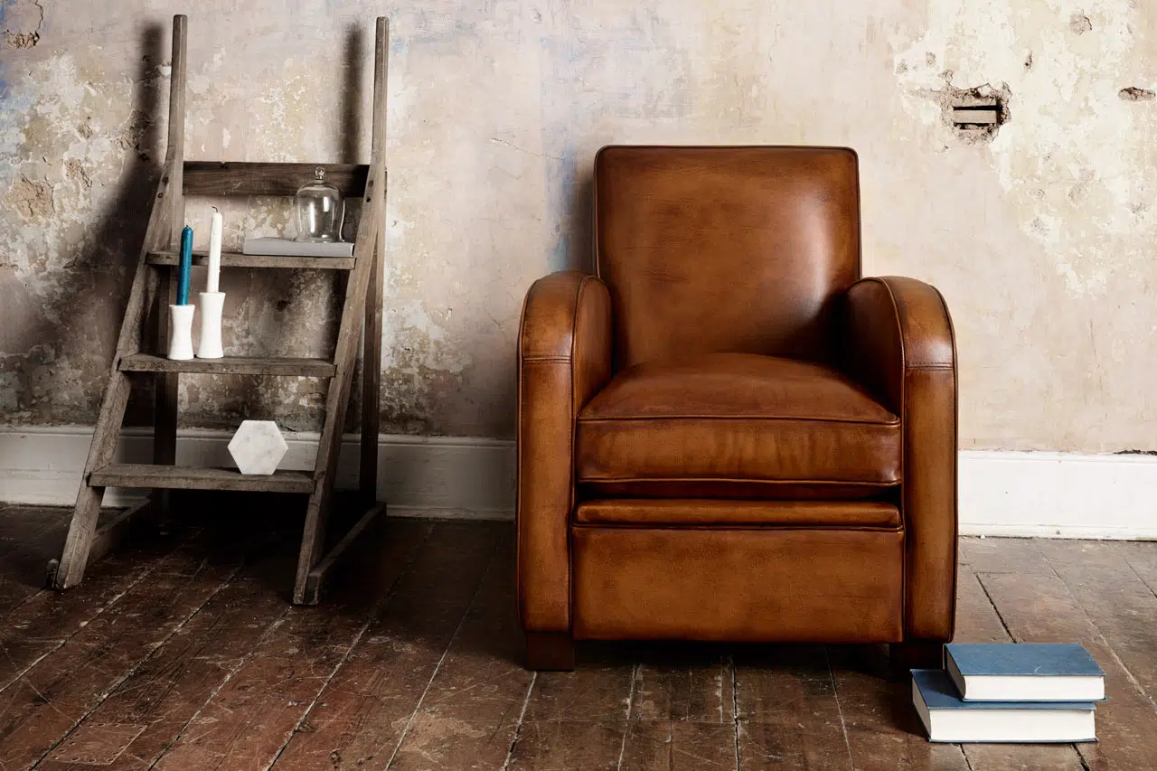 Sloop art deco leather chair with smooth flowing contours and harmonious form