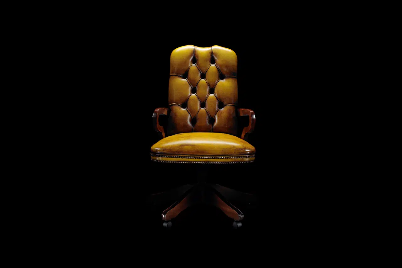Lord chesterfield office chair with carved arm details and swivel base